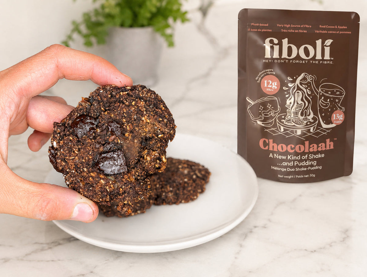 Hand holding Double Chocolate Banana Breakfast Cookies made with fiboli