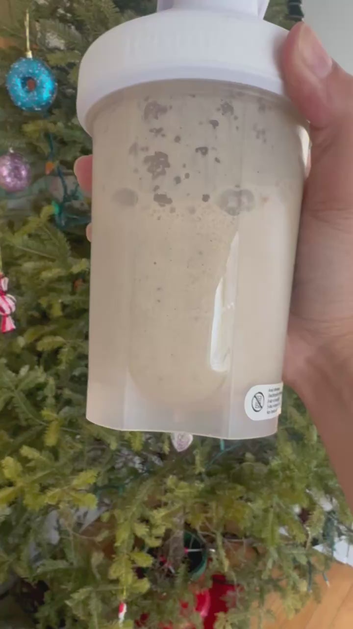 Person shaking fiboli apple shake vigorously