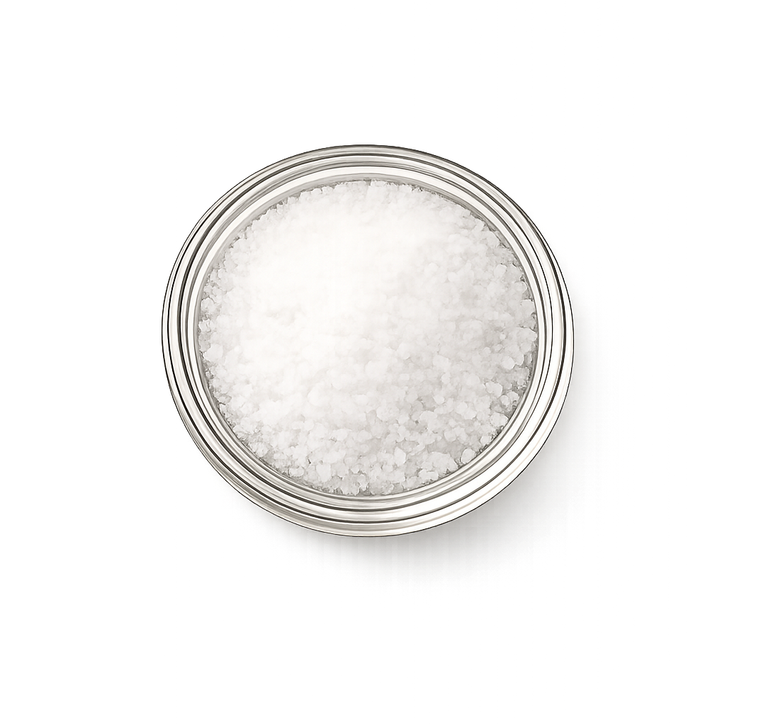 Silver container filled with white granulated sea salt on a white background