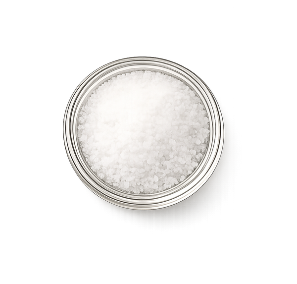 Silver container filled with white granulated sea salt on a white background